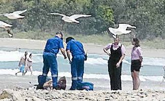 Lucky: A man is helped by paramedics after he was rescued on Digger’s Beach. Lucky: A man is helped by paramedics after he was rescued on Digger’s Beach.